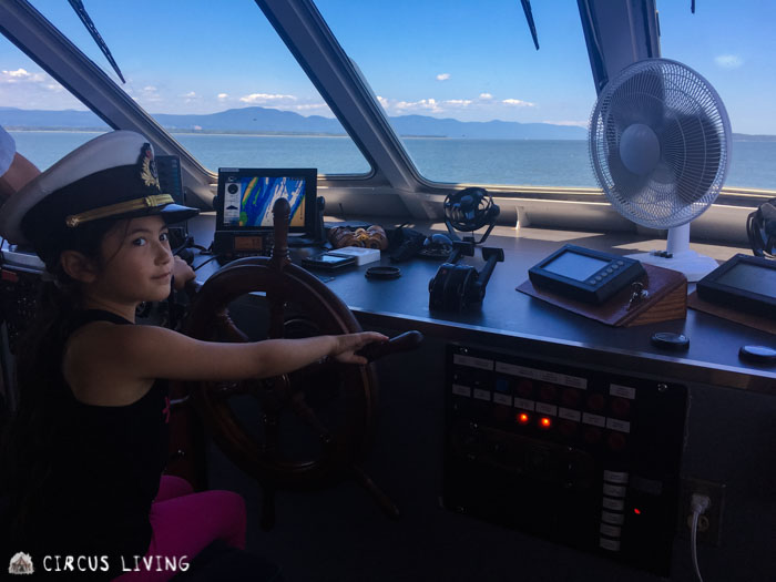 Kiarra driving the boat to Grosse &icirc;le pier